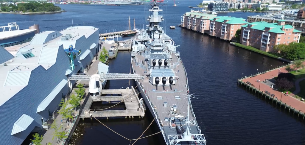 Drone capture an aerial view of a large ship.